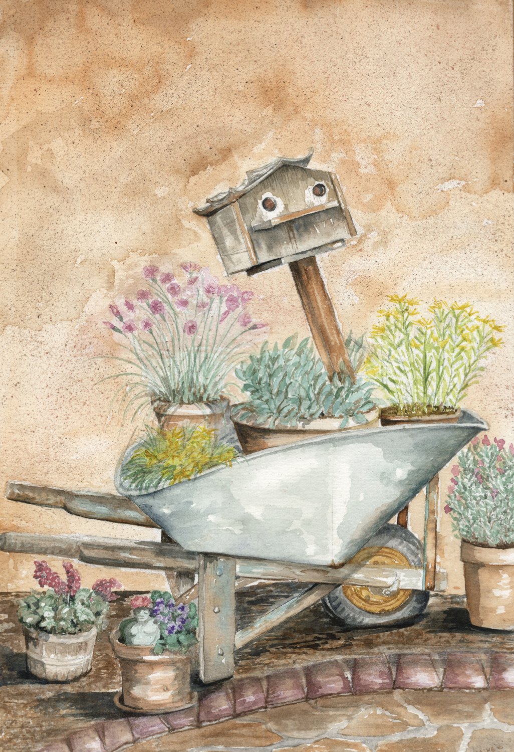 Watercolor still life of a vintage metal wheelbarrow filled with potted flowering plants and a weathered birdhouse on a post, against an adobe wall
